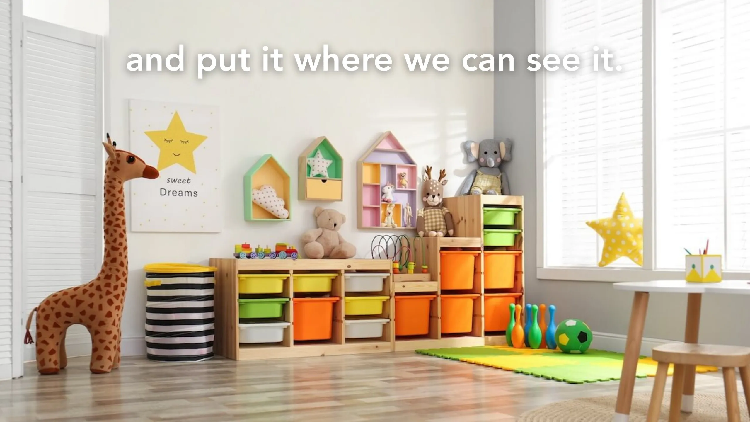 Manifesto slide: “and put it where we can see it.” over a tidy playroom with bins and a toy giraffe