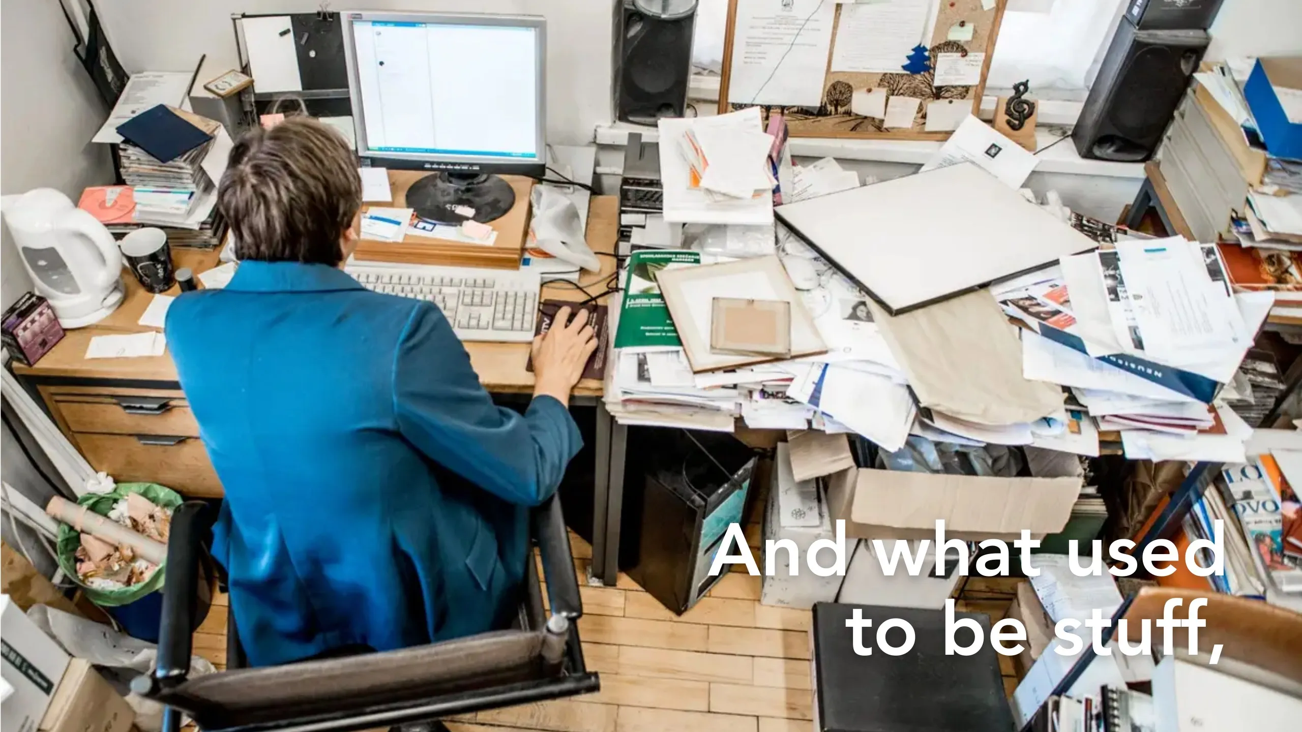 Manifesto slide: “And what used to be stuff,” over a person at a desk buried in paper